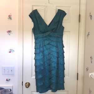 Knee length, ruffled teal dress